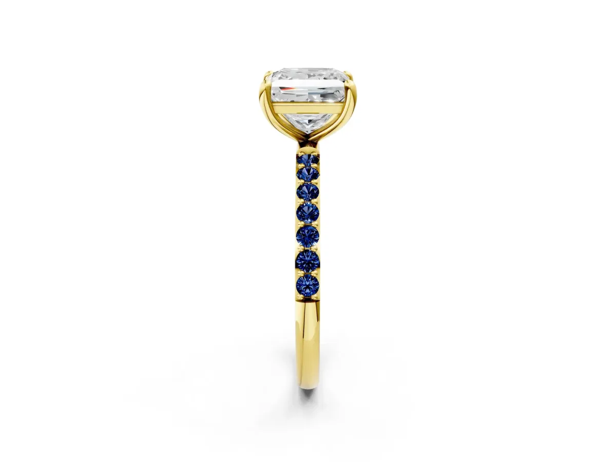 Princess Cut Diamond Solitaire Ring with Round Blue Sapphire Pavé Band and Prong Setting Yellow gold
