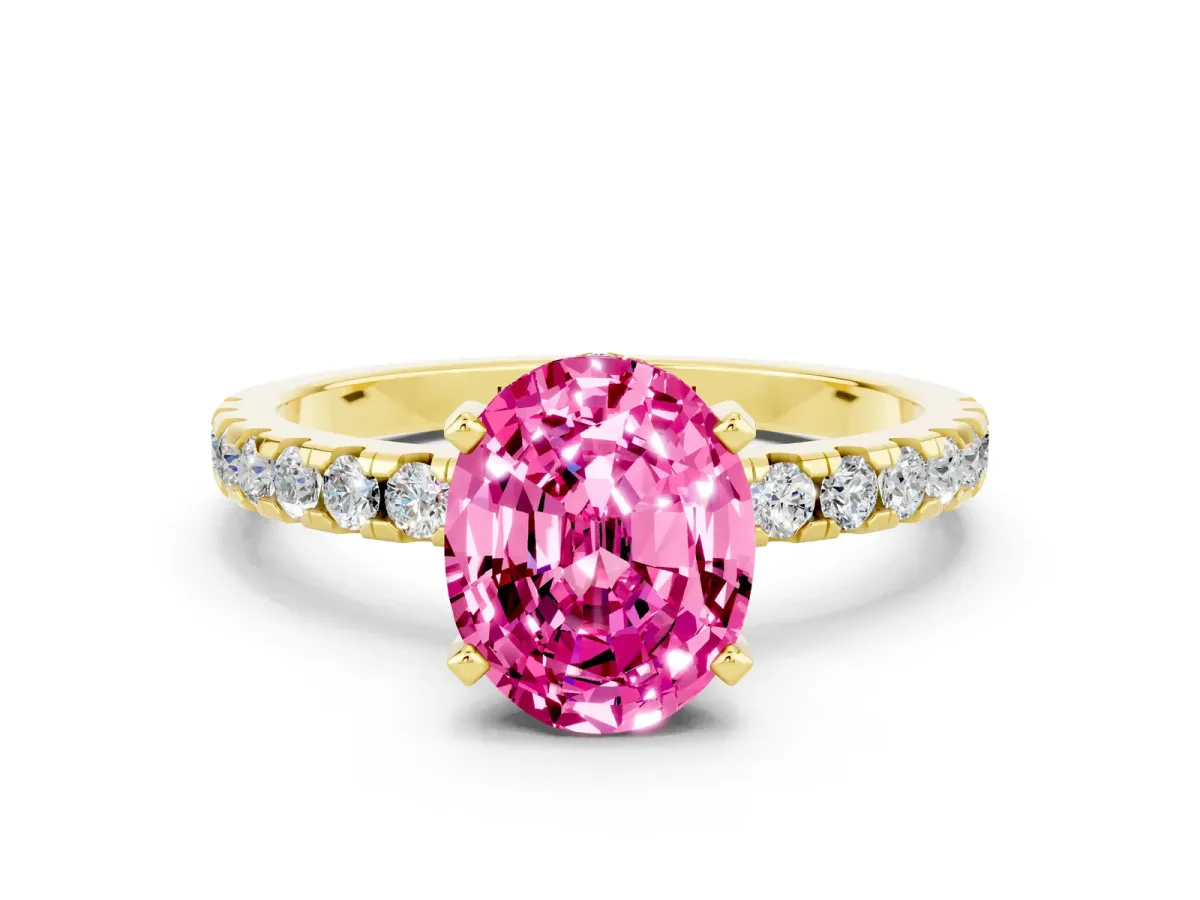 Oval Cut Pink Sapphire Solitaire Ring with Round Pavé Band and Four-Prong Setting Yellow gold