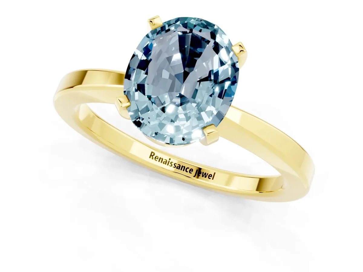 Oval Cut Aquamarine Solitaire Engagement Ring with Classic Band and Four-Prong Setting Yellow gold