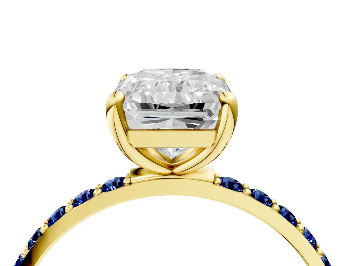 Radiant Cut Diamond Solitaire Ring with Round Blue Sapphire Pavé Band and Prong Setting Yellow gold