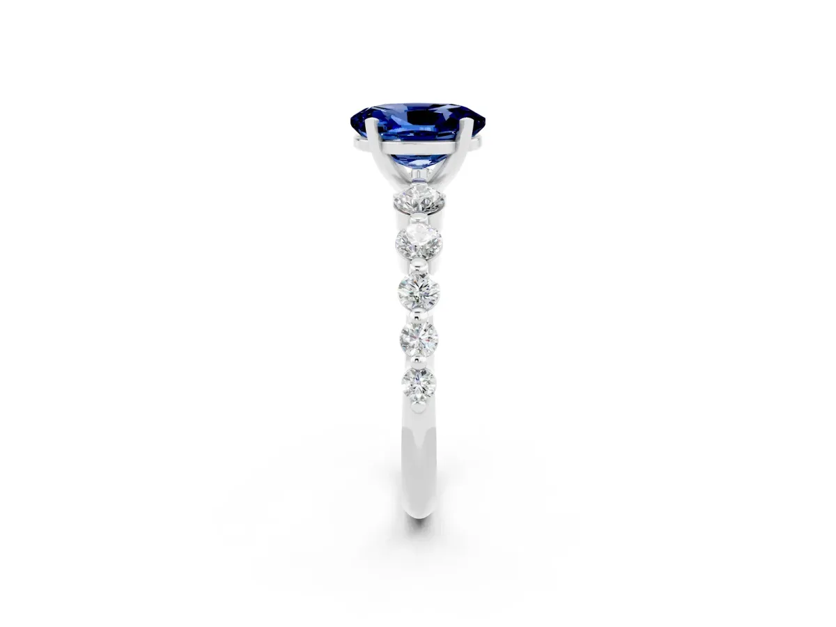 Oval Cut Solitaire Blue Sapphire Ring with Pave Band and Four-Prong Setting Platinum