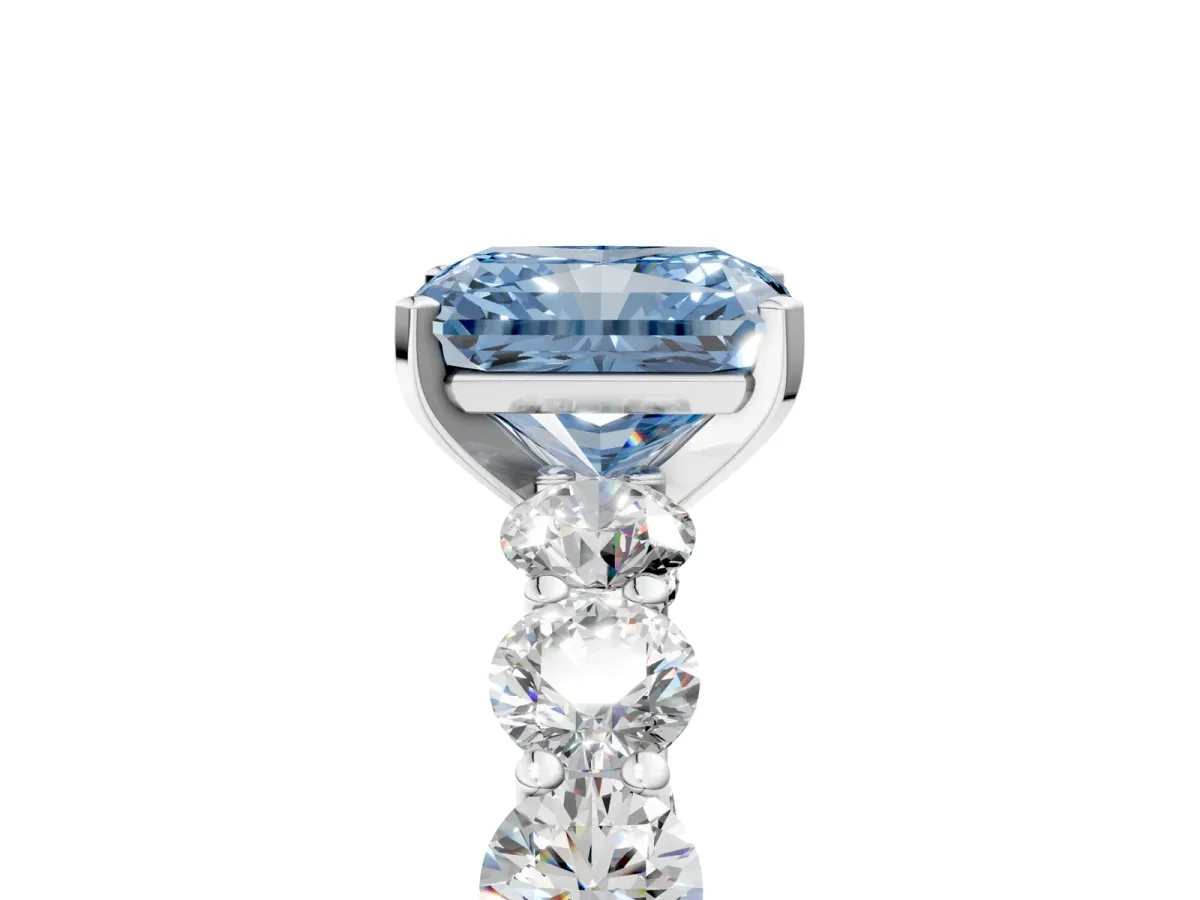 Fancy Blue Radiant Cut Diamond Prong Setting with Side Stones on a Pave Band Silver