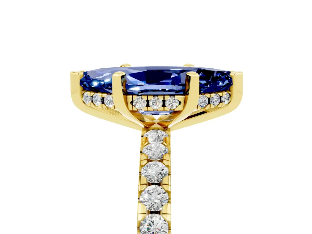 Marquise Cut Blue Sapphire Solitaire Ring with Round Pavé Band and Four-Prong Setting Yellow gold