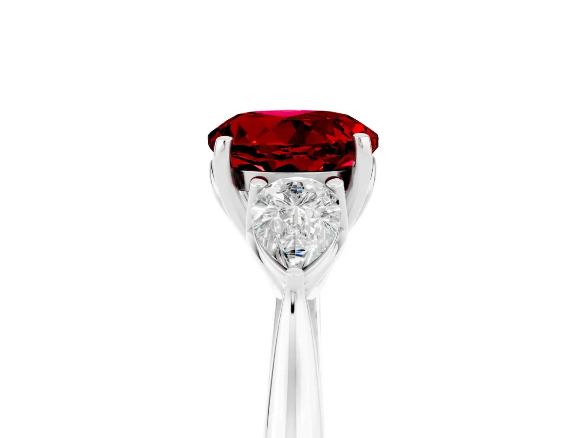 Three-Stone Round Cut Ruby Ring with Pear Side Stones in Four-Prong Setting Platinum
