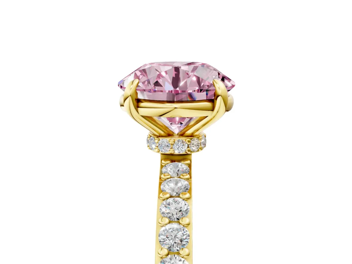 Fancy Pink Round Cut Diamond Solitaire Engagement Ring with Pavé Band and Four-Prong Setting Yellow gold