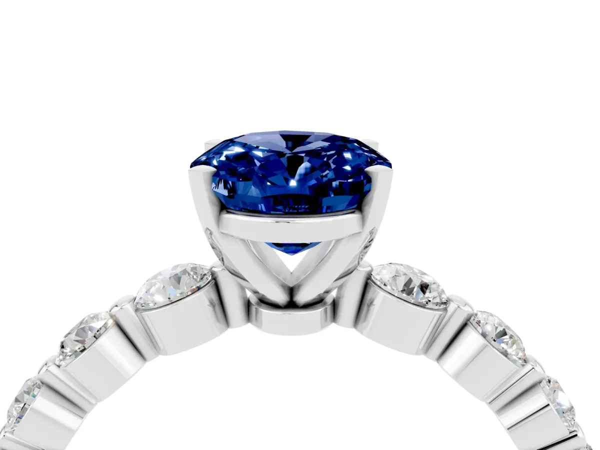 Oval Cut Solitaire Blue Sapphire Ring with Pave Band and Four-Prong Setting Platinum