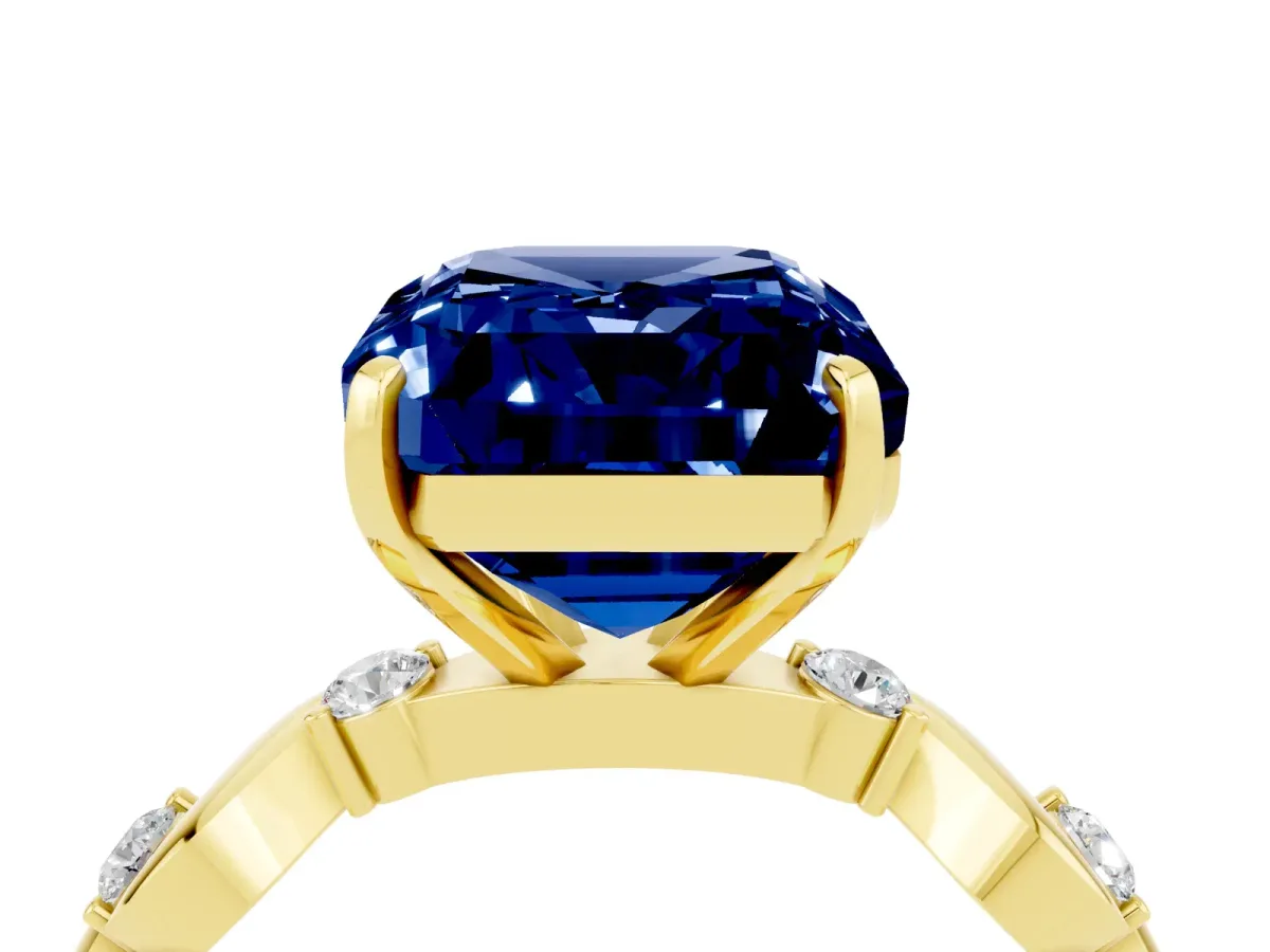 Emerald Cut Blue Sapphire Solitaire Twisted Band with Round Accents and Prong Setting Yellow gold