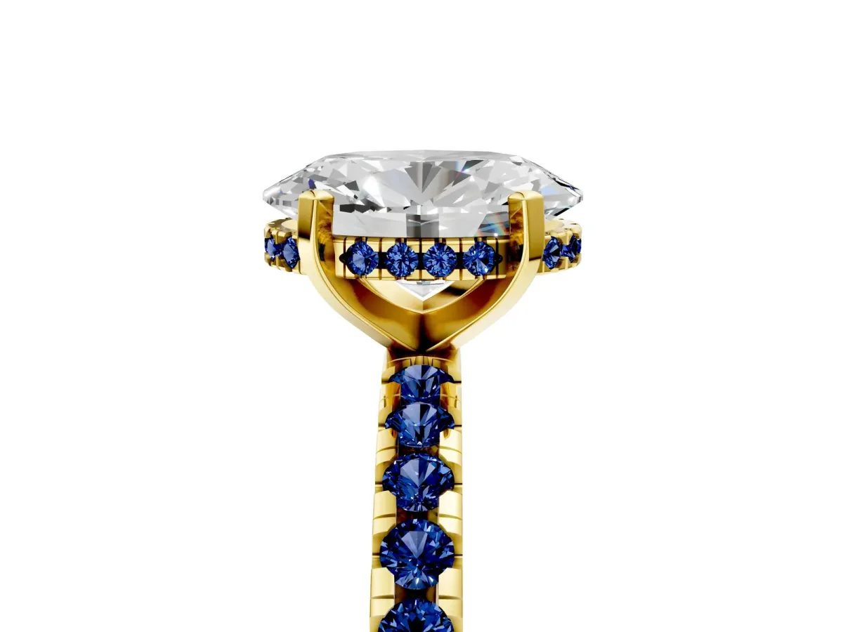 Oval Cut Diamond Solitaire Ring with Round Blue Sapphire Pavé Band and Four-Prong Setting Yellow gold