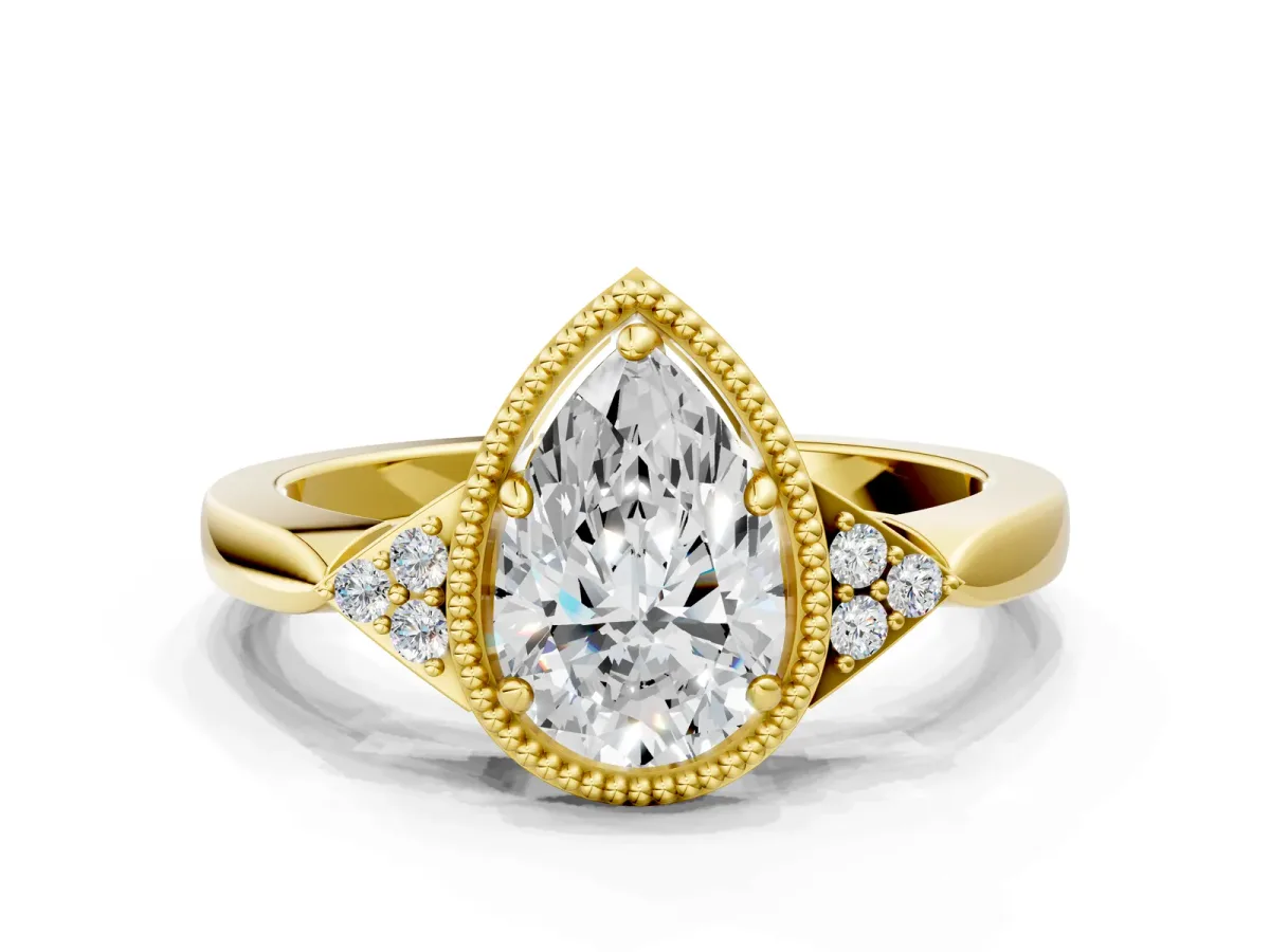 Milgrain Pear Cut Cut Diamond Ring with Tapered Pave Band and Four Prong Setting Yellow gold