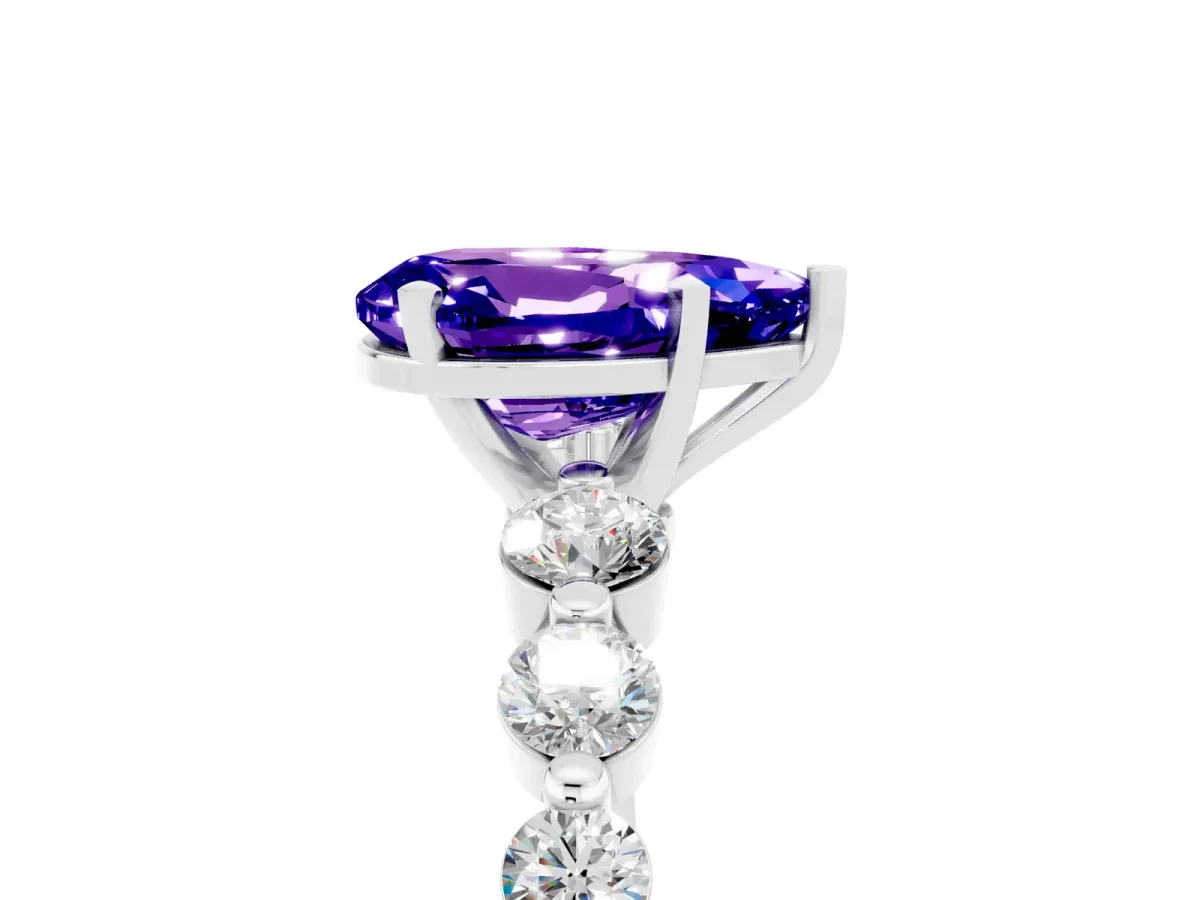 Pear Cut Solitaire Tanzanite Ring with Pave Band and Four-Prong Setting Silver