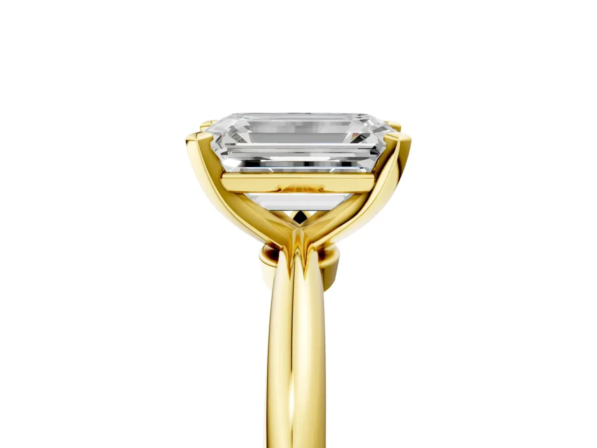 Emerald Cut Diamond Solitaire Ring with Six-Prong Setting and Classic Band Yellow gold