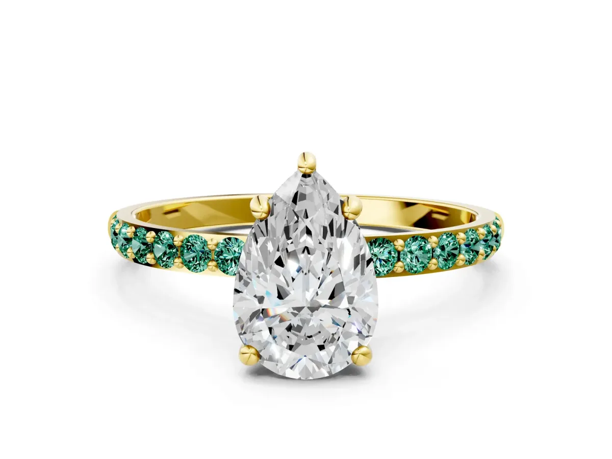 Pear Cut Diamond Solitaire Ring with Round Green Sapphire Pavé Band and Prong Setting Yellow gold