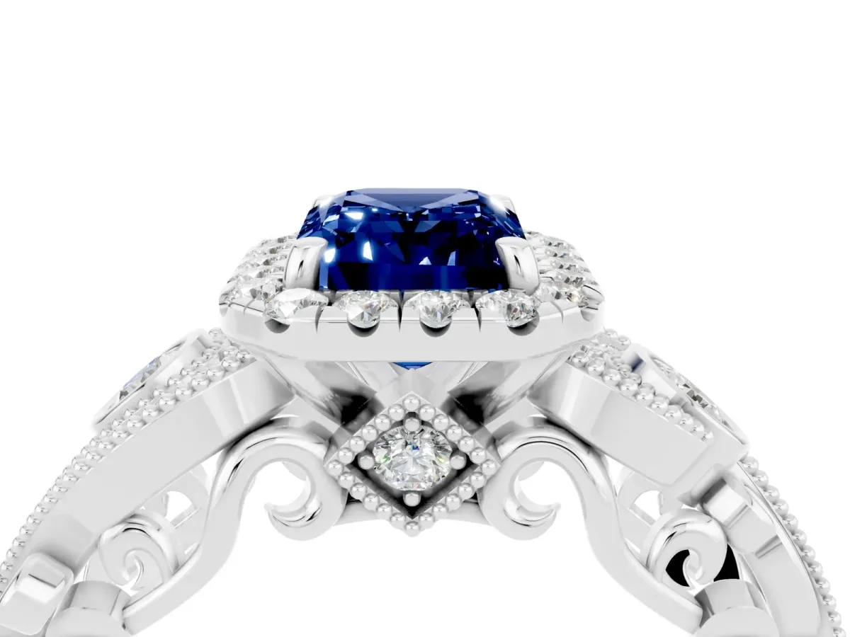 Emerald Cut Blue Sapphire Halo Ring with Milgrain Pavé Band and Four-Prong Setting White gold