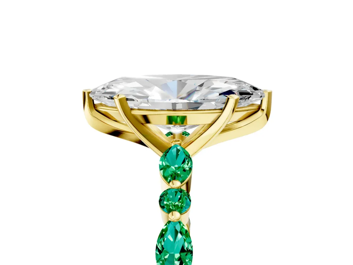 Marquise Cut Diamond Ring with Marquise and Round Emerald Side Stones and Four-Prong Setting Yellow gold