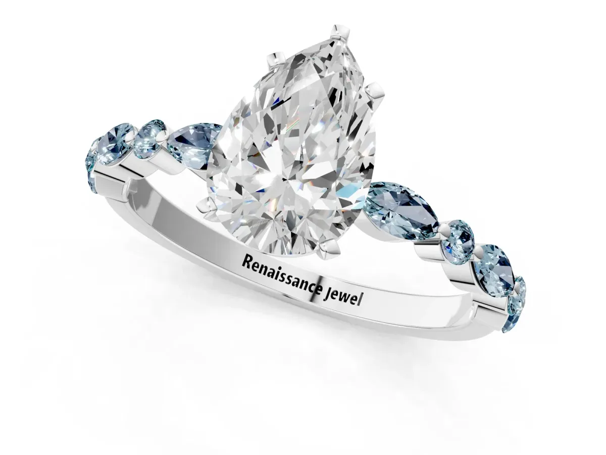 Pear Cut Diamond Ring with Marquise and Round Aquamarine Side Stones and Four-Prong Setting White gold