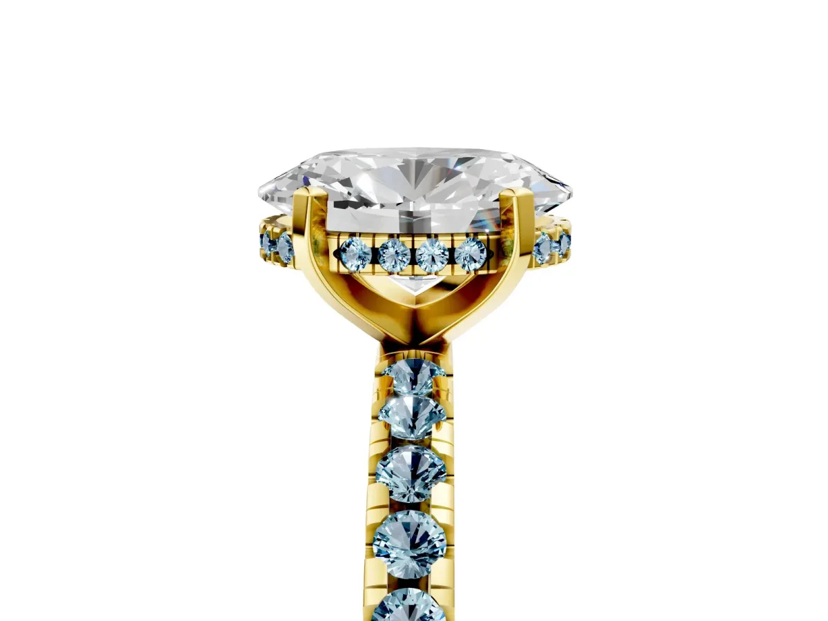 Oval Cut Diamond Solitaire Ring with Round Aquamarine Pavé Band and Four-Prong Setting Yellow gold