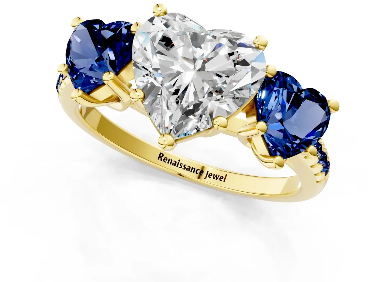Three-Stone Heart Cut Diamond Ring with Round Blue Sapphire Pavé Band and Prong Setting Yellow gold