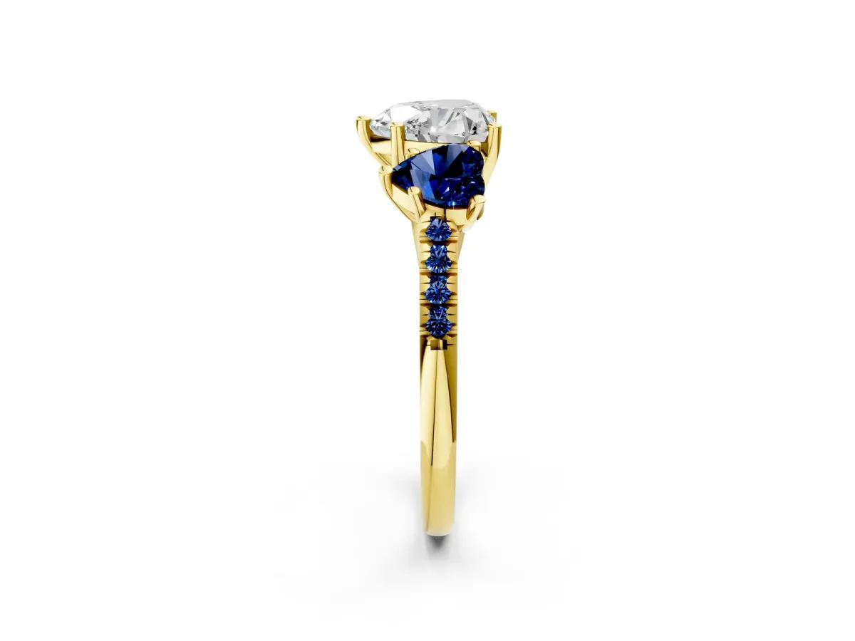Three-Stone Heart Cut Diamond Ring with Round Blue Sapphire Pavé Band and Prong Setting Yellow gold