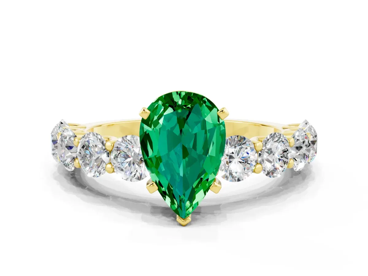Pear Cut Emerald Prong Setting with Side Stones on a Pave Band Yellow gold