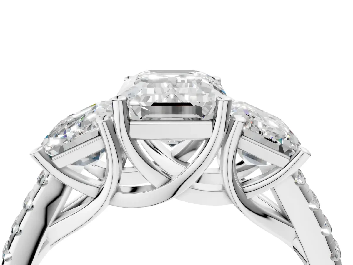 Three-Stone Emerald Cut Diamond Ring with Round Pavé Band and Prong Setting White gold