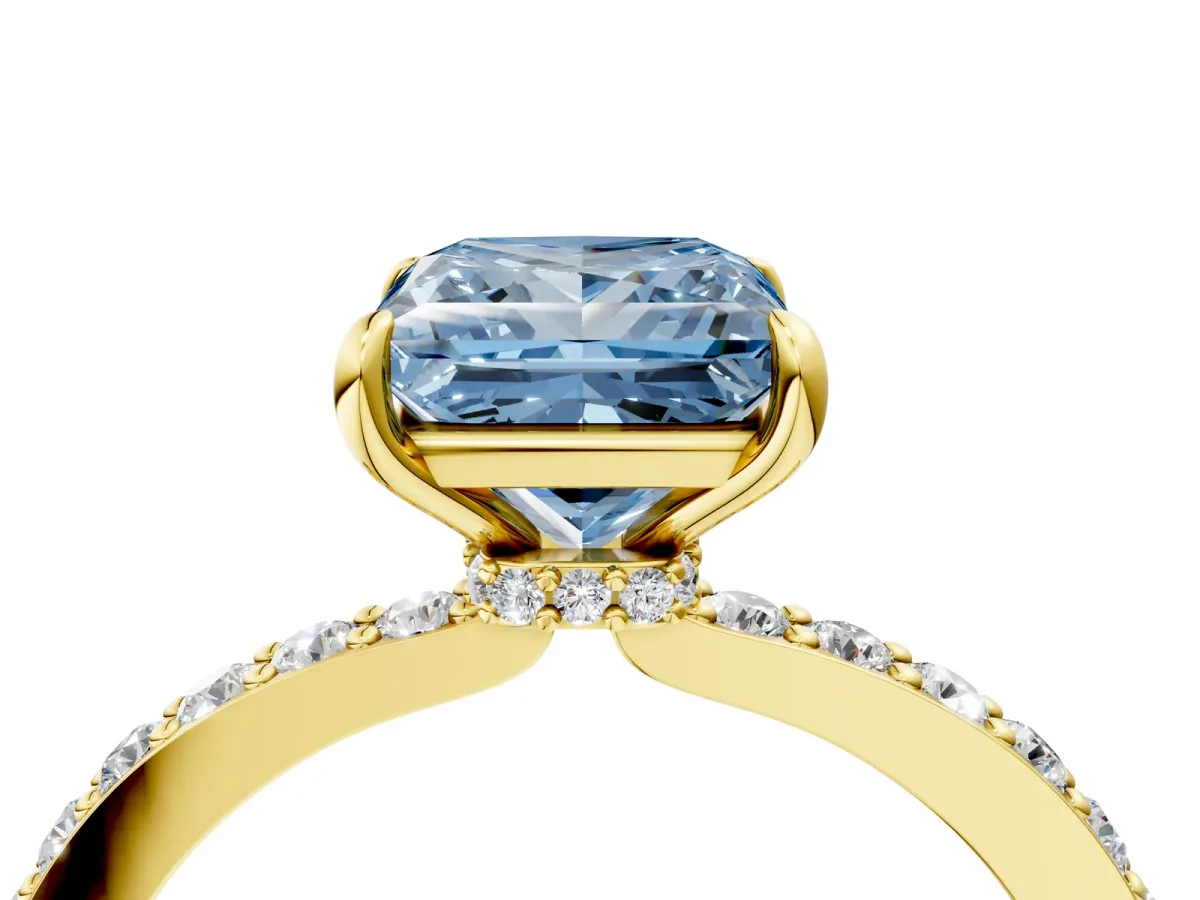 Fancy Blue Princess Cut Diamond Solitaire Engagement Ring with Pavé Band and Four-Prong Setting Yellow gold
