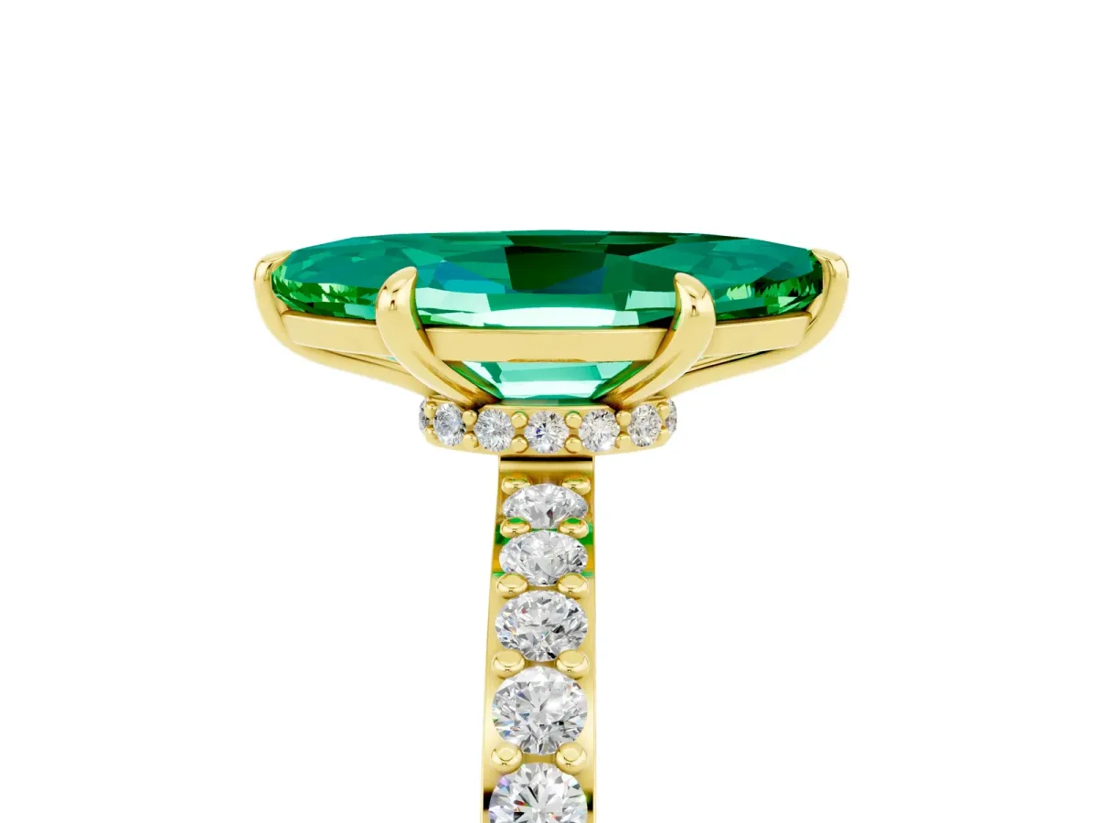 Marquise Cut Emerald Solitaire Engagement Ring with Pavé Band and Four-Prong Setting Yellow gold