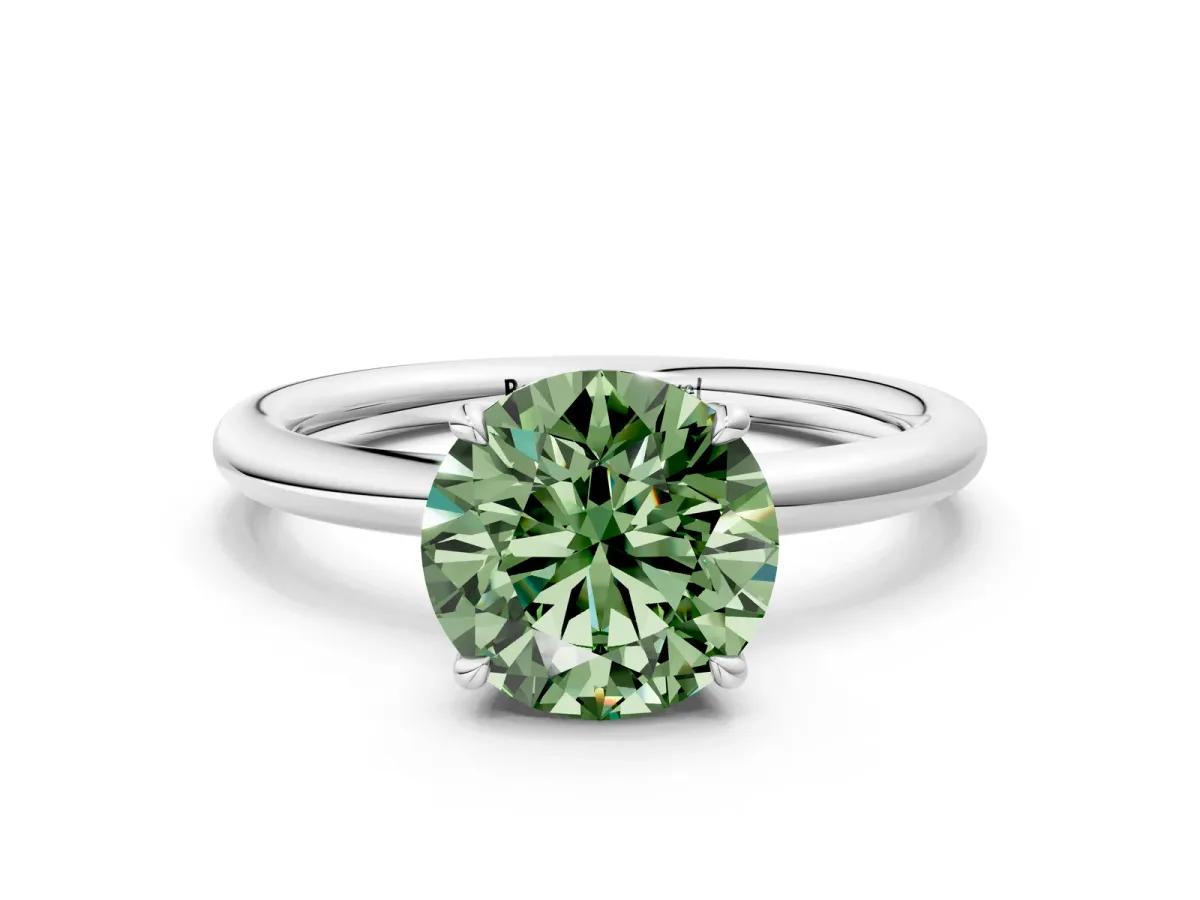 Fancy Green Round Cut Diamond Solitaire Ring with Thin Band and Four-Prong Setting Silver
