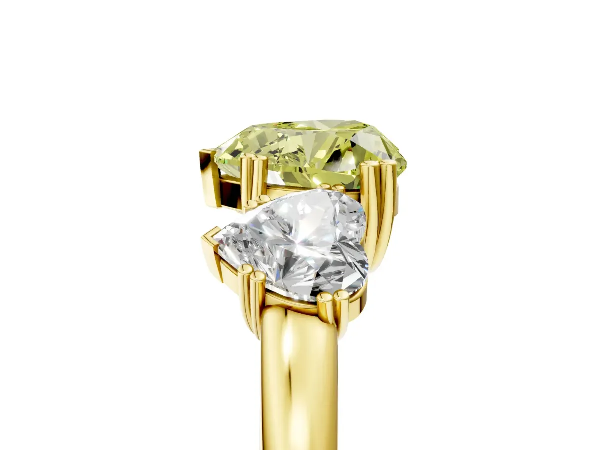 Fancy Yellow Three-Stone Heart Cut Cut Diamond Ring with Channel Set Band and Four-Prong Setting Yellow gold