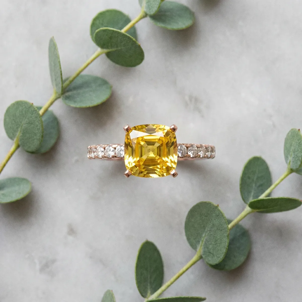 Cushion Cut Yellow Sapphire Solitaire Ring with Round Pavé Band and Four-Prong Setting Rose gold