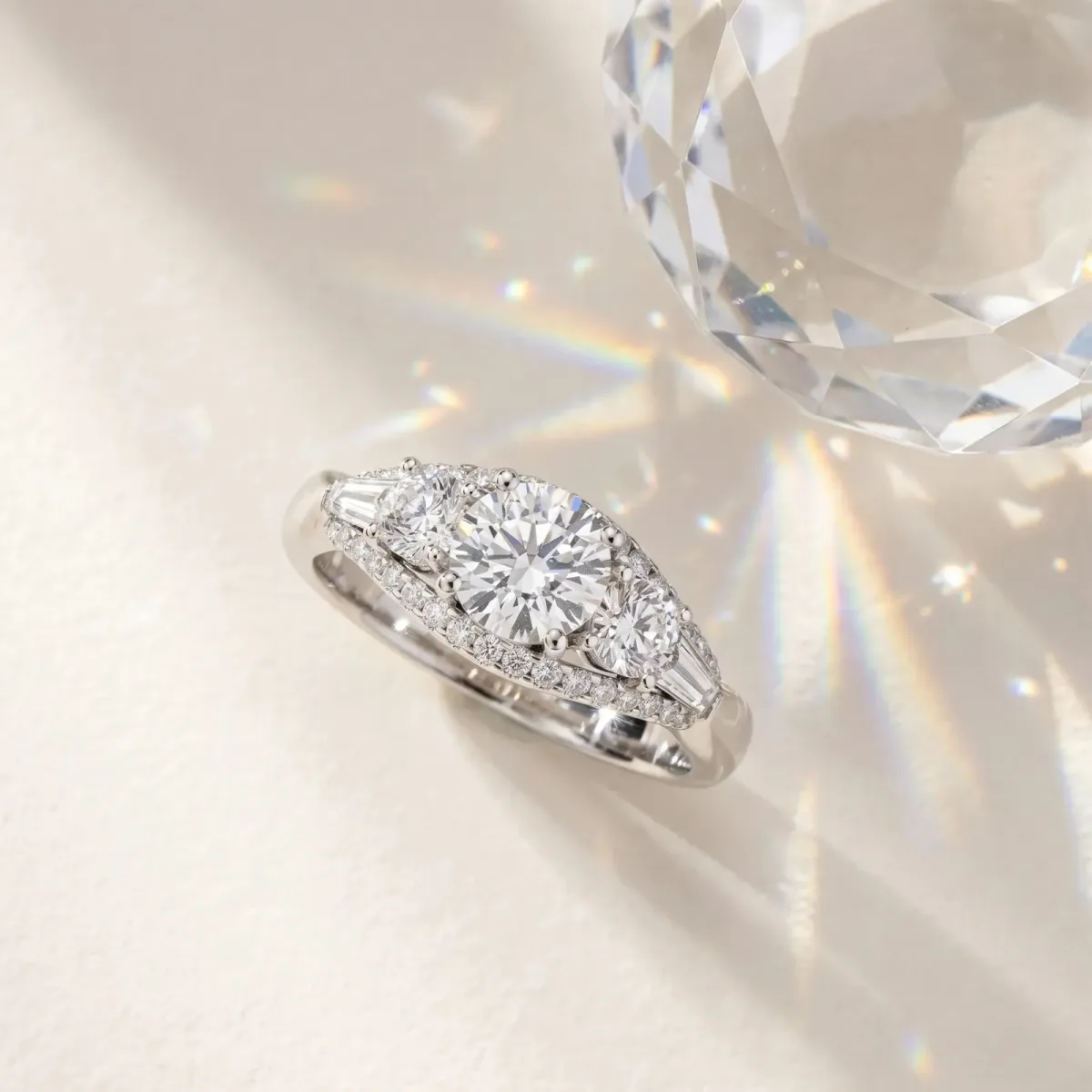 Three-Stone Radiant Cut Diamond Engagement Ring with Pave Band and Prong Setting Platinum