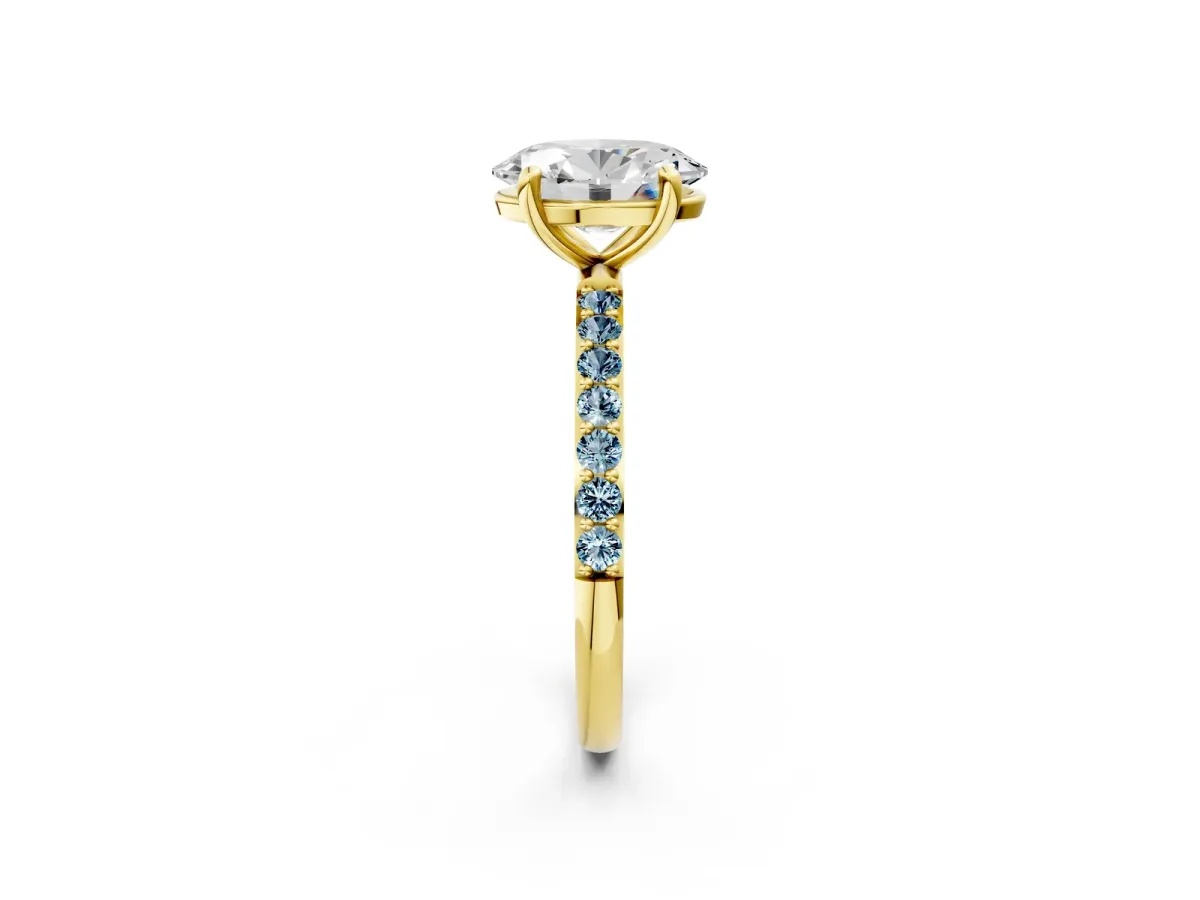 Oval Cut Diamond Solitaire Ring with Round Aquamarine Pavé Band and Prong Setting Yellow gold