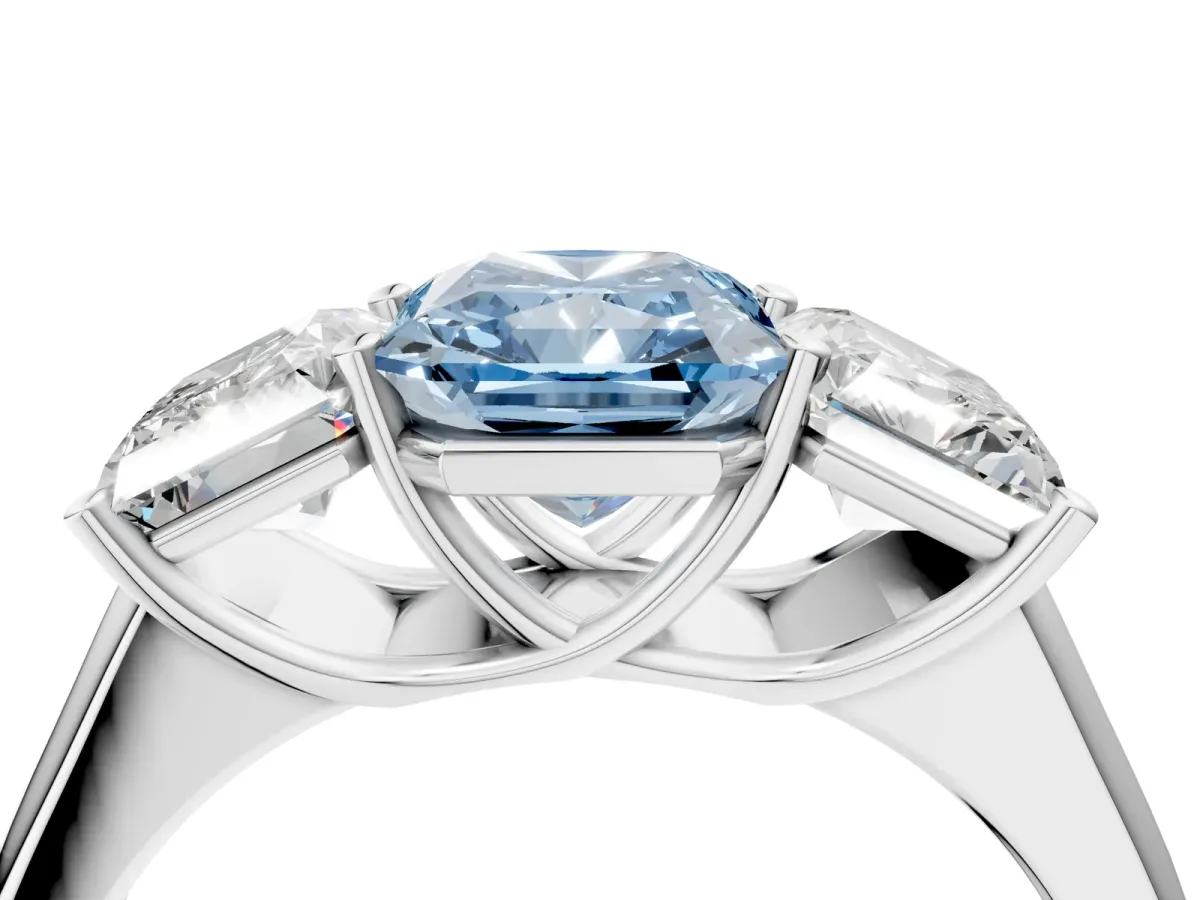Fancy Blue Radiant Cut Three-Stone Diamond Ring with Prong Setting on a Classic Band Platinum