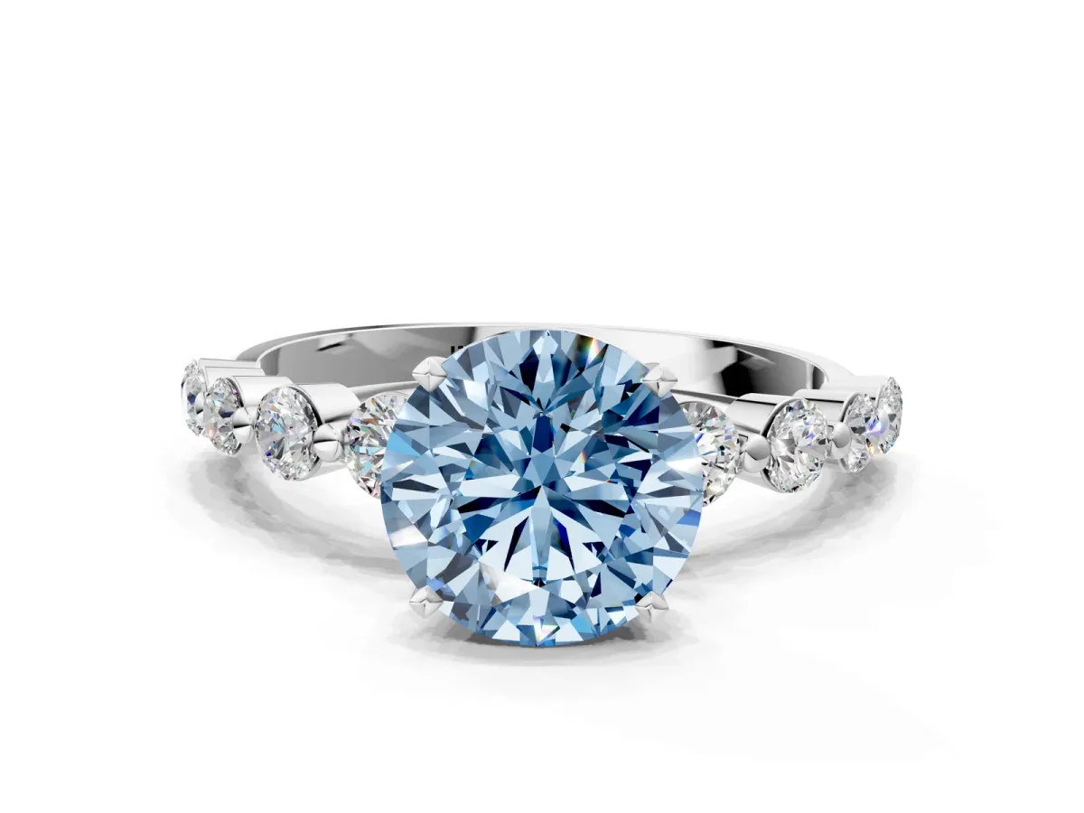 Fancy Blue Round Cut Solitaire Diamond Ring with Pave Band and Four-Prong Setting Silver