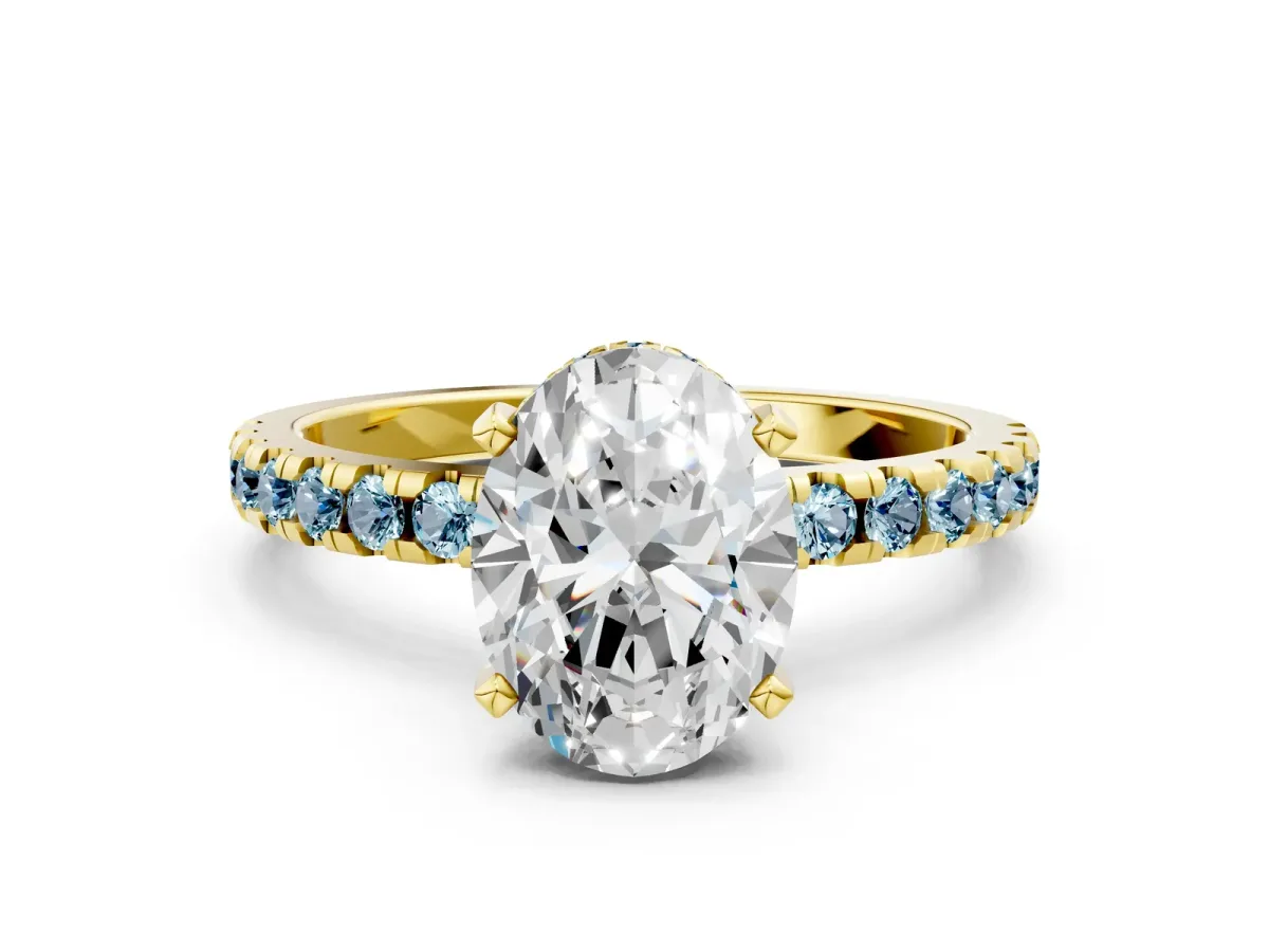 Oval Cut Diamond Solitaire Ring with Round Aquamarine Pavé Band and Four-Prong Setting Yellow gold