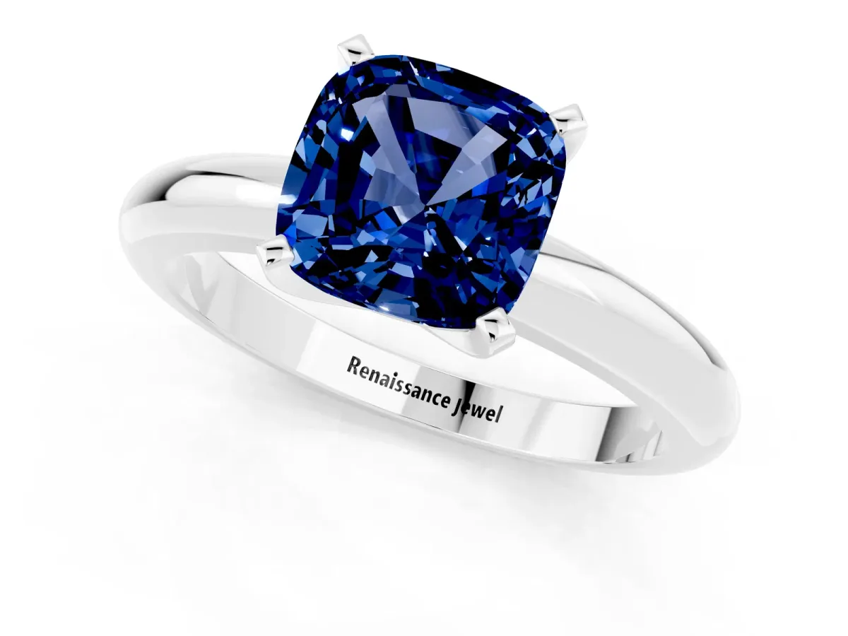 Cushion Cut Blue Sapphire Solitaire Engagement Ring with Round Band and Four-Prong Setting White gold