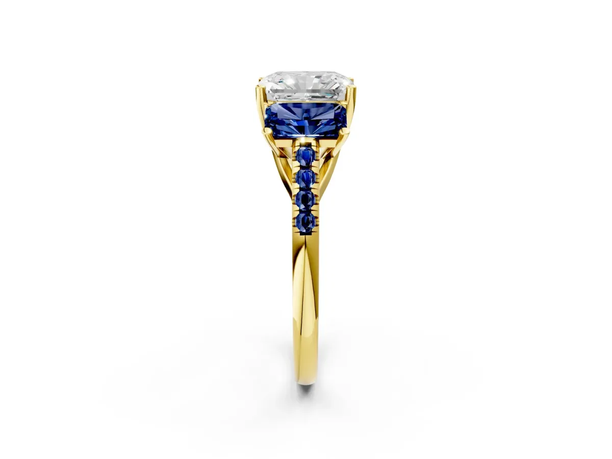 Three-Stone Radiant Cut Diamond Ring with Round Blue Sapphire Pavé Band and Prong Setting Yellow gold