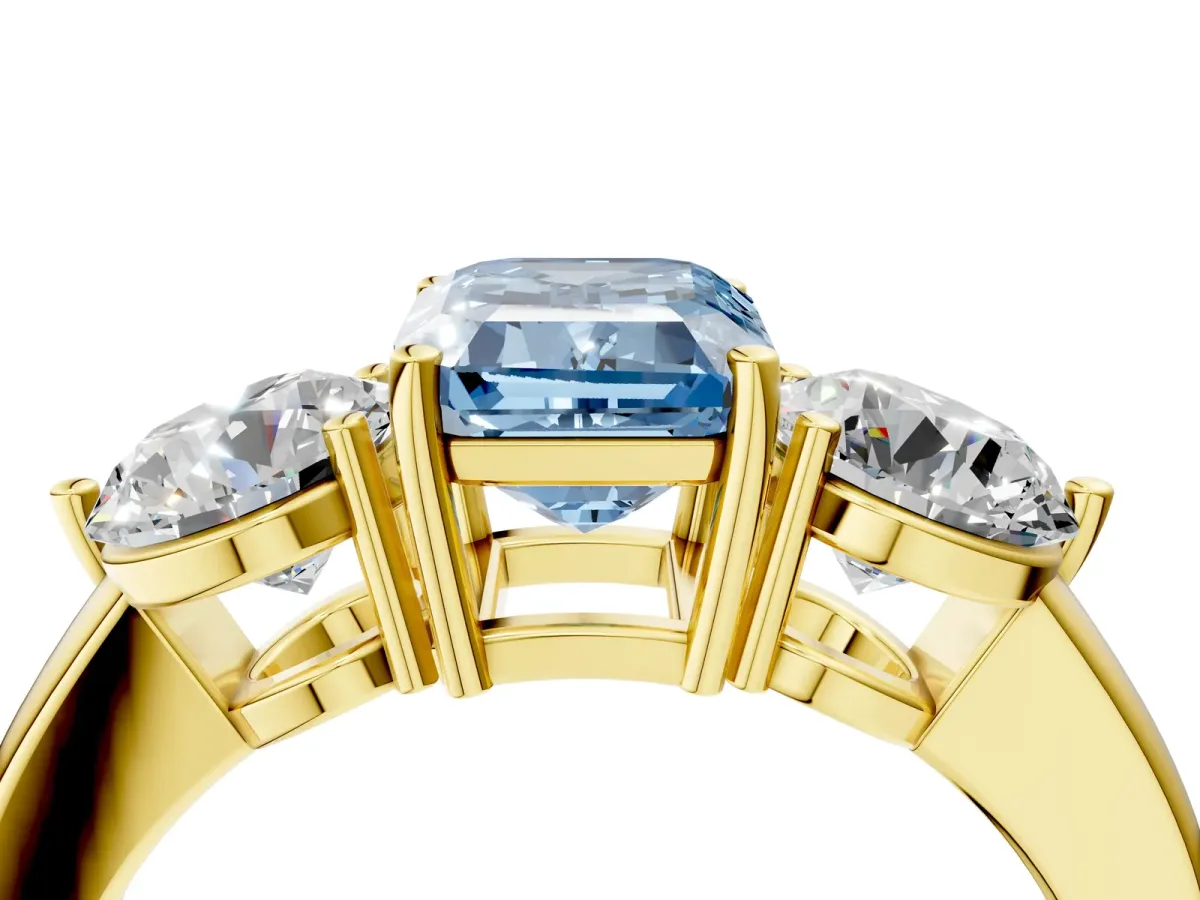 Fancy Blue Emerald Cut Diamond Three-Stone Ring with Prong Setting and Classic Band Yellow gold
