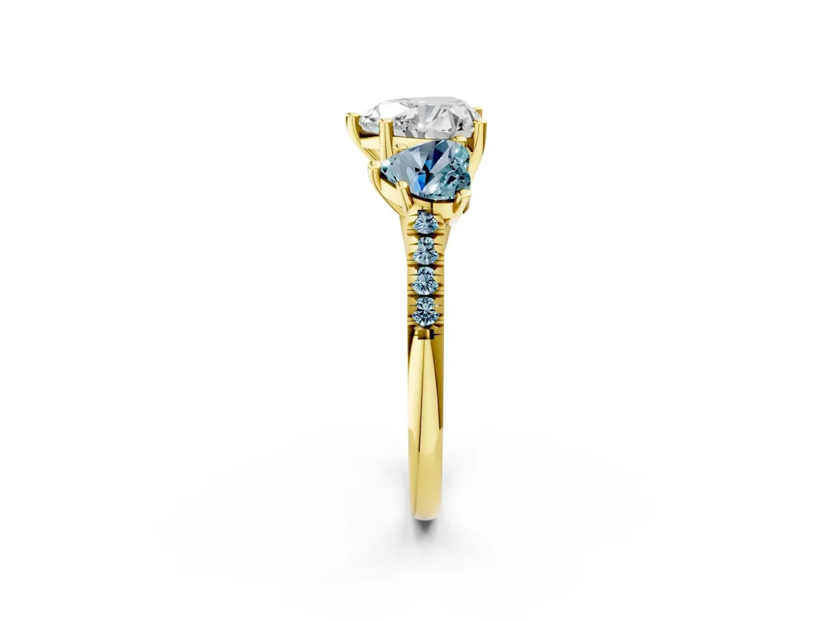 Three-Stone Heart Cut Diamond Ring with Round Aquamarine Pavé Band and Prong Setting Yellow gold