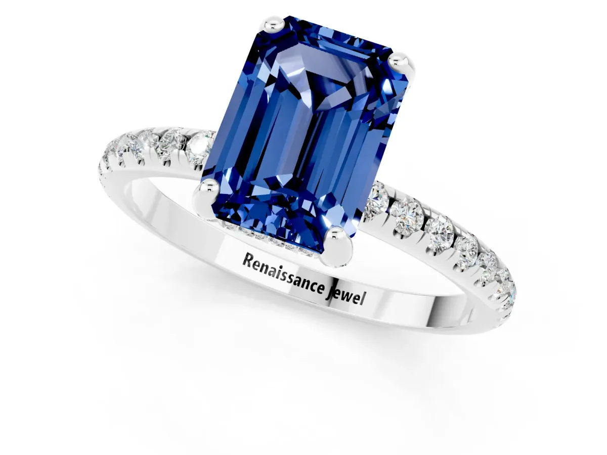 Emerald Cut Blue Sapphire Hidden Halo Engagement Ring with Round Pavé Band and Prong Setting Silver
