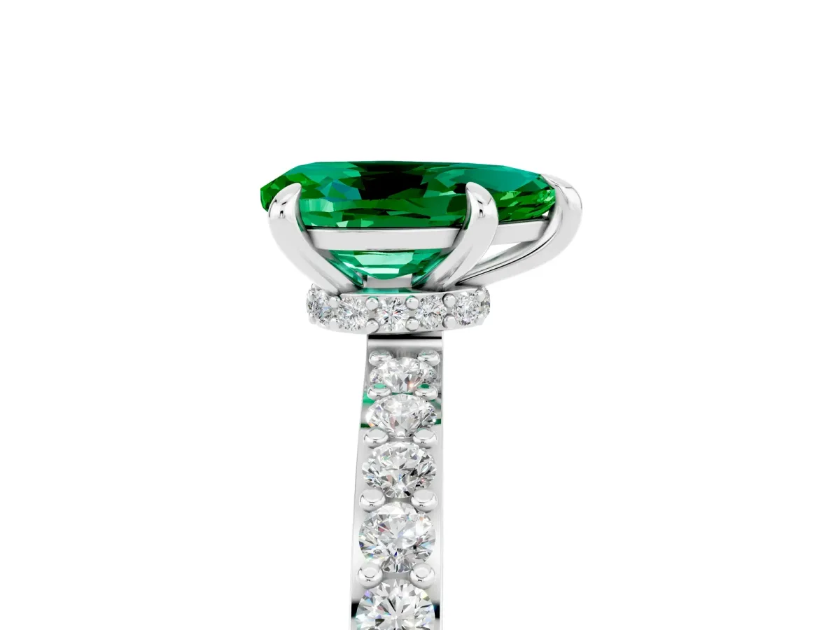 Pear Cut Emerald Solitaire Engagement Ring with Pavé Band and Four-Prong Setting Silver