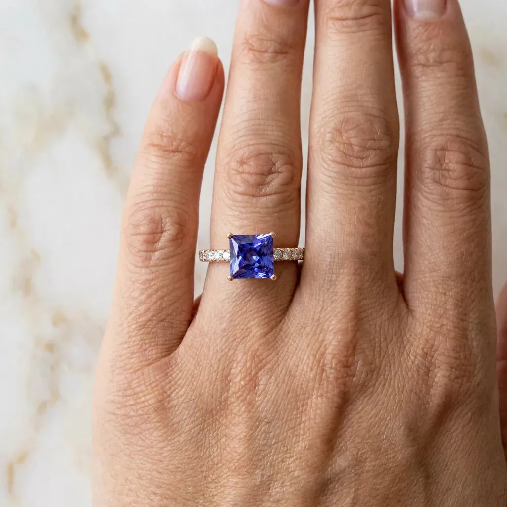 Princess Cut Tanzanite Solitaire Ring with Round Pavé Band and Four-Prong Setting Rose gold