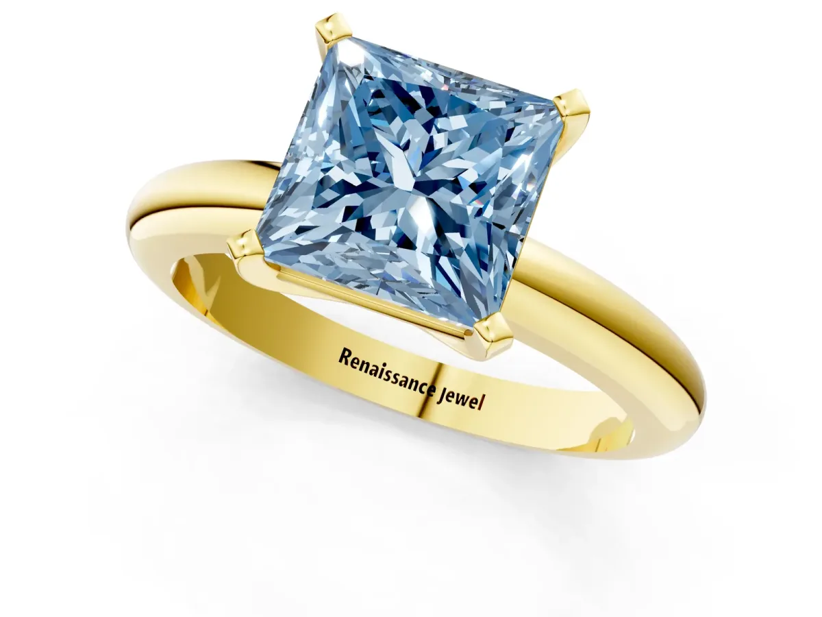 Fancy Blue Princess Cut Diamond Solitaire Engagement Ring with Round Band and Four-Prong Setting Yellow gold
