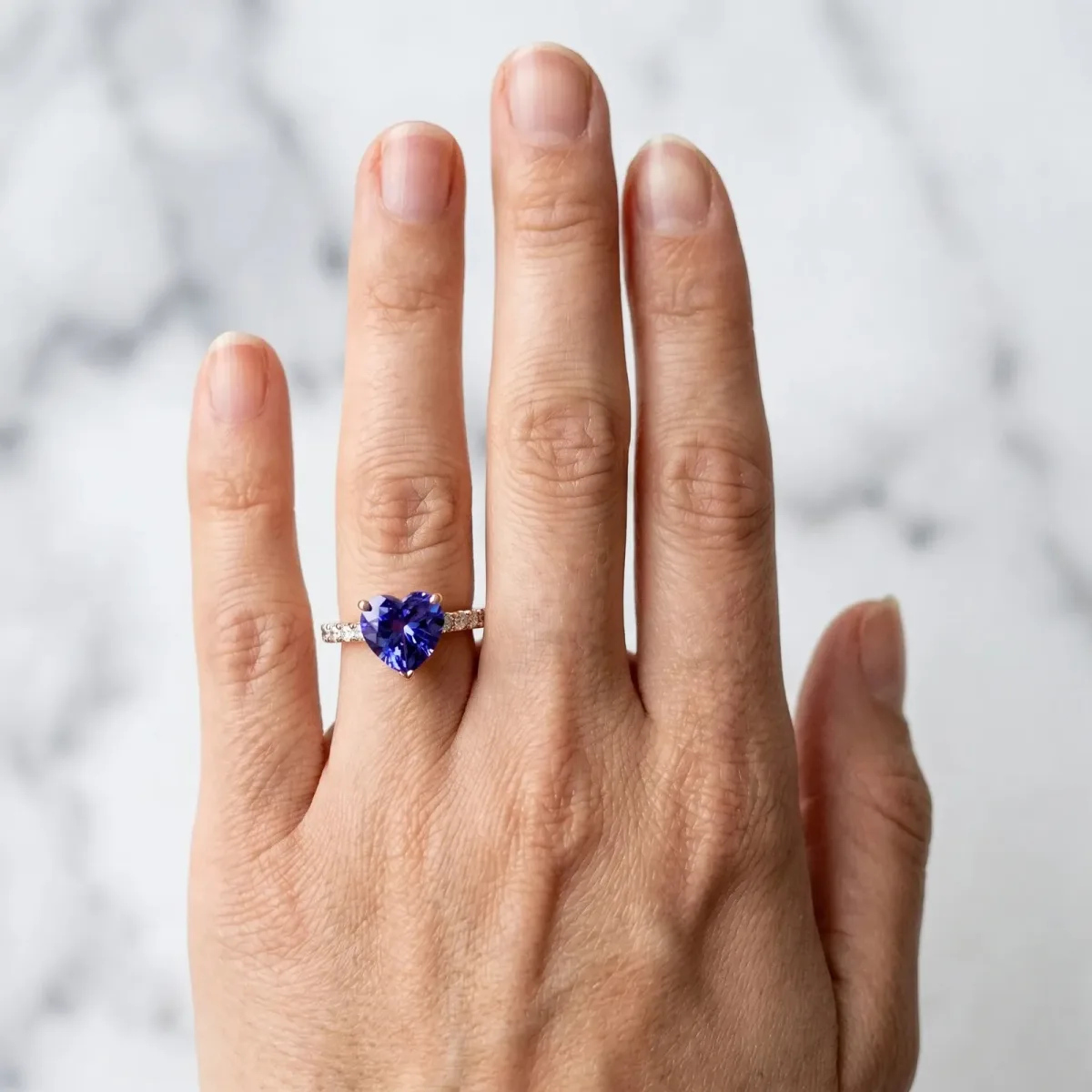 Heart Cut Tanzanite Solitaire Ring with Round Pavé Band and Four-Prong Setting Rose gold