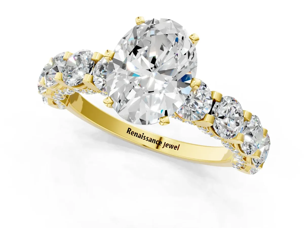 Oval Cut Diamond Side Stone Engagement Ring with Four-Prong Setting Yellow gold
