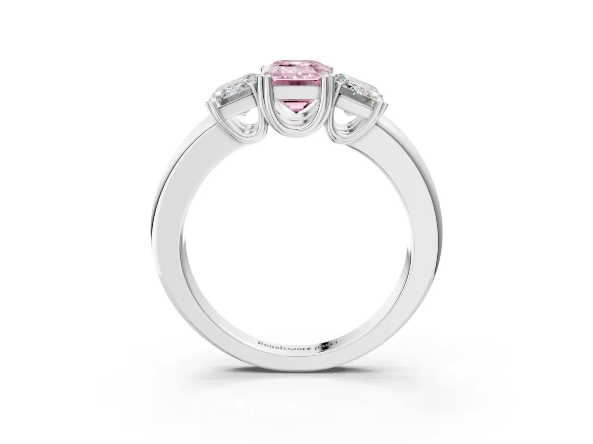 Fancy Pink Three-Stone Emerald Cut Cut Diamond Ring with Channel Set Band and Four-Prong Setting Platinum