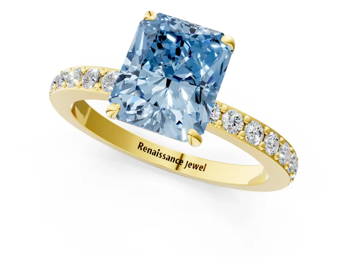 Fancy Blue Radiant Cut Diamond Solitaire Engagement Ring with Pavé Band and Four-Prong Setting Yellow gold