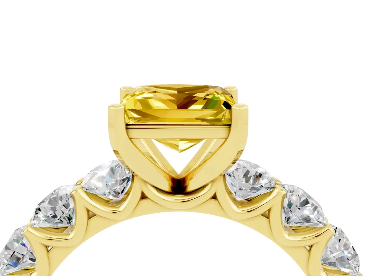 Princess Cut Yellow Sapphire Prong Setting with Side Stones on a Pave Band Yellow gold