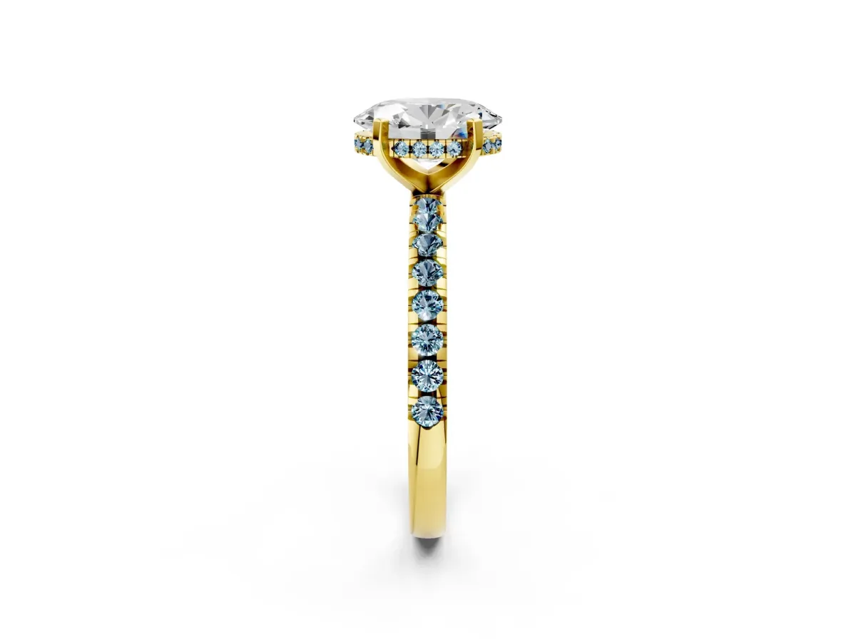Oval Cut Diamond Solitaire Ring with Round Aquamarine Pavé Band and Four-Prong Setting Yellow gold
