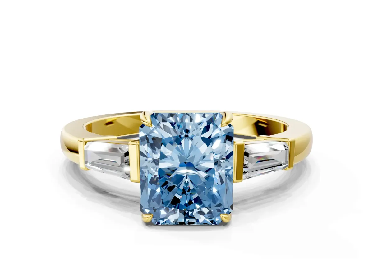 Fancy Blue Radiant Cut Diamond Three-Stone Ring with Tapered Baguette Side Stones and Prong Setting Yellow gold