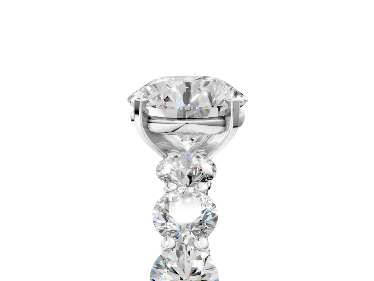 Round Cut Diamond Prong Setting with Side Stones on a Pave Band White gold